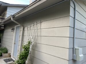 Exterior electrical conduit and junction box installed on the side of a house by All 4 You Electrical in Boise, ID.