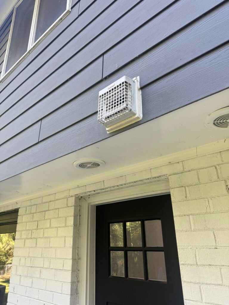 An exterior dryer vent on a residential home, serviced by Delta Clean Air in Boston, MA