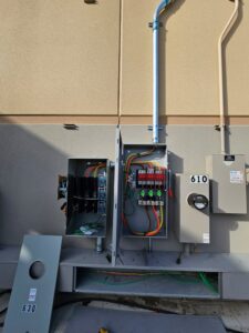An open exterior electrical box showing wiring during an installation by Acevedo's Electric in Dallas, TX.