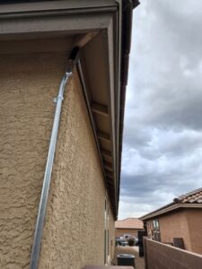 Exterior electrical conduit neatly installed along the side of a house by CDB Electrical LLC in Tucson, AZ.