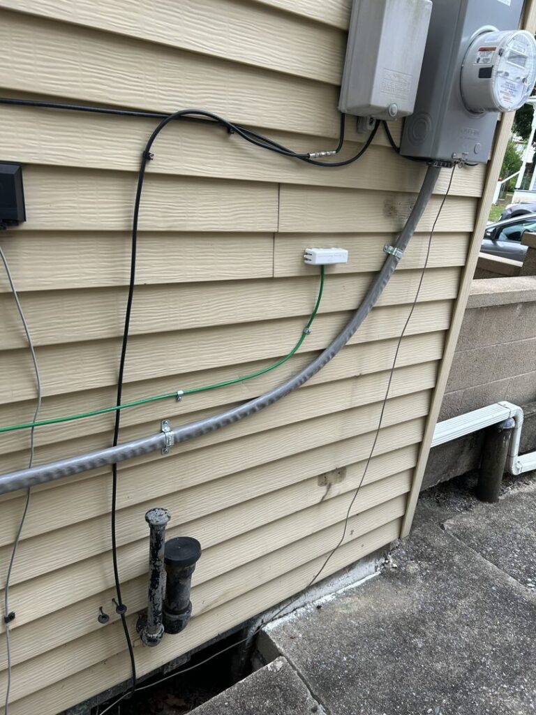 Exterior electrical conduit and wiring installation by 2 Live Wires in Slatington, PA.