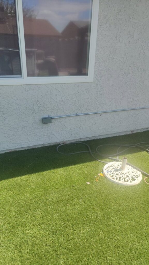 Exterior electrical conduit installed along a stucco wall by Canyon Electric Company, Inc. in North Las Vegas, NV