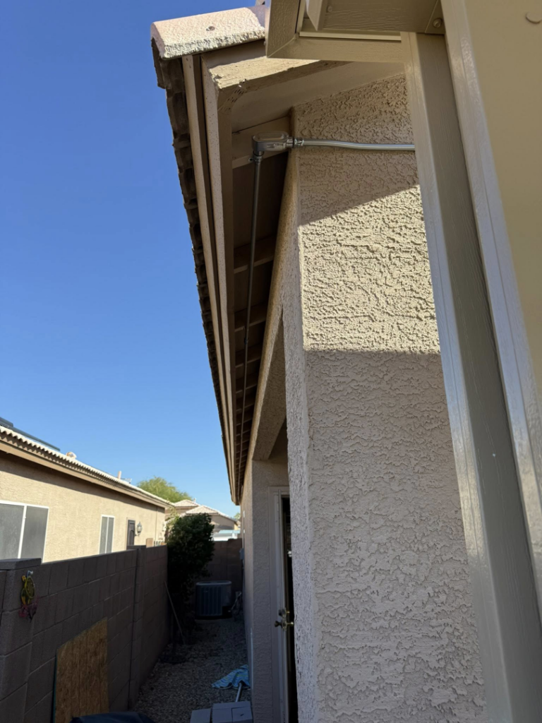 Exterior electrical conduit installation on a home by Dependable Sparky Electric in Peoria, AZ
