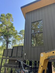 Exterior electrical conduit installation on a modern building by Nelson Electric, Inc. in Hot Springs, AR.