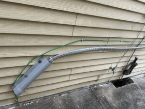 Exterior electrical conduit and wiring repair by 2 Live Wires in Slatington, PA.
