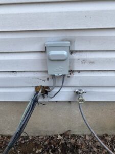 Exterior electrical conduit and wiring installation on a house by CLB Electrical LLC in Townsend, DE.