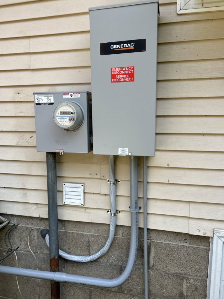 Exterior electrical meter and service disconnect box installed by Ardent Electric in Erie, PA.