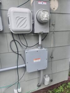 Exterior electrical meter and conduit installation by 2 Live Wires in Slatington, PA.