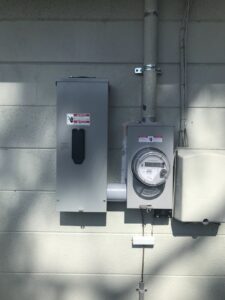 An exterior electrical meter and disconnect box installation by 60HZ Electric in St. Petersburg, FL.