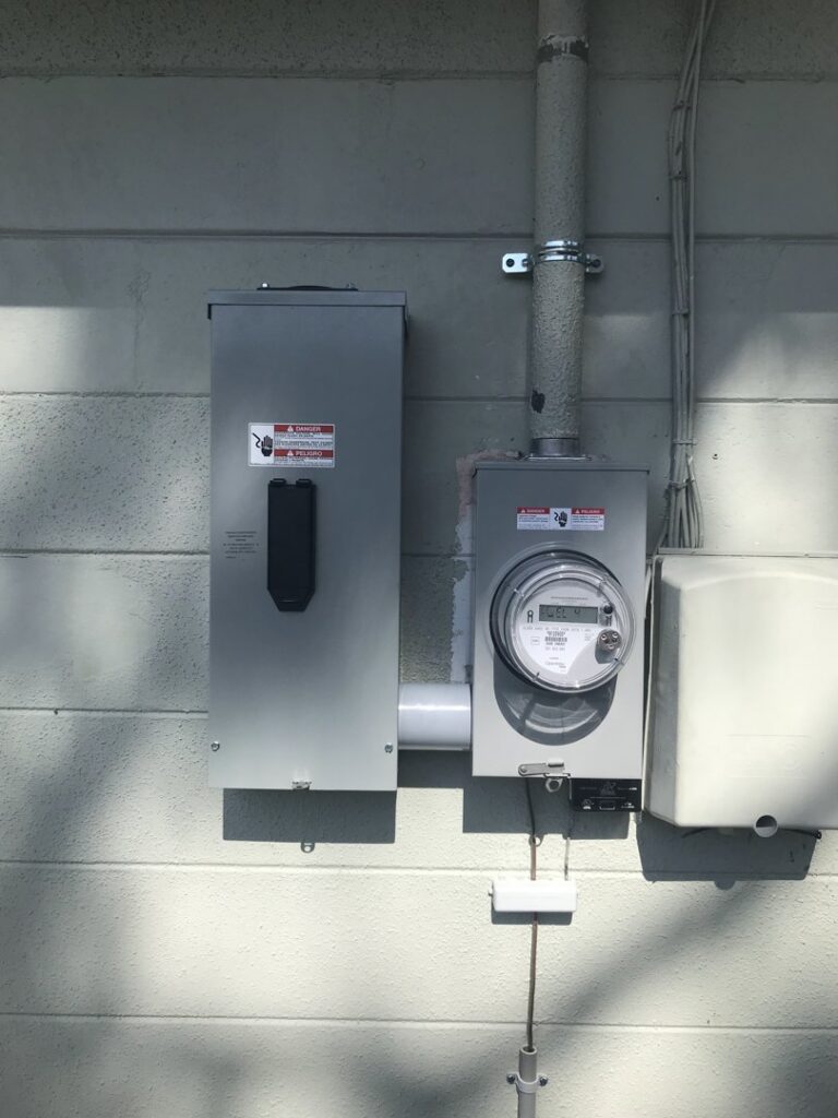An exterior electrical meter and disconnect box installation by 60HZ Electric in St. Petersburg, FL.