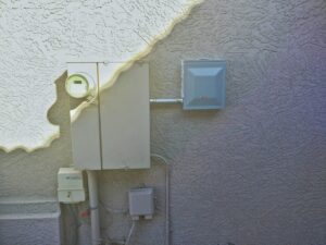 An exterior electrical meter and panel boxes installed by Farris Electric LLC in Glendale, AZ.