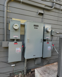 A newly installed exterior electrical meter and panel system on a building by LN Electrical in Coeur D Alene, ID
