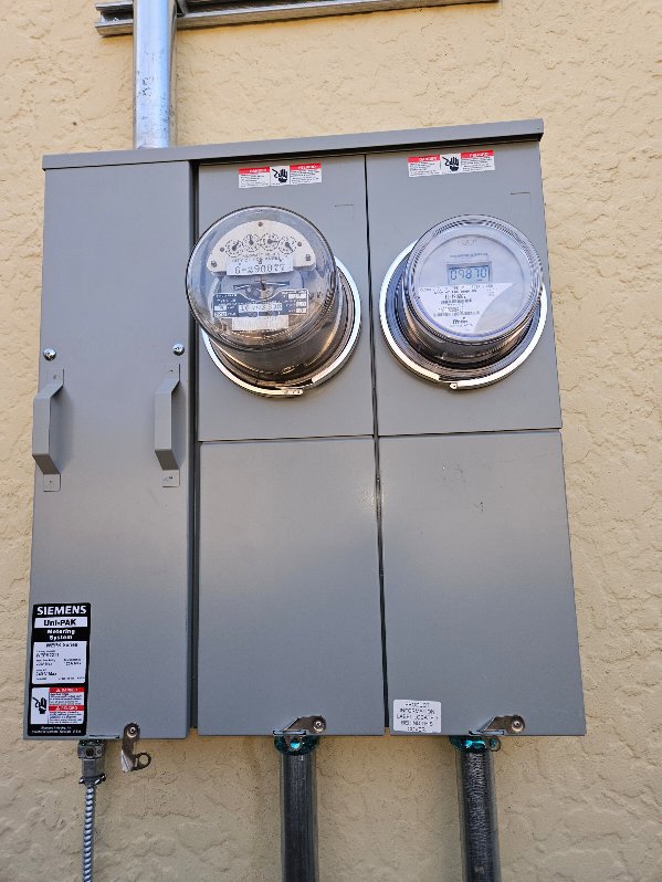 An exterior electrical meter panel with two utility meters, installed by Muse Electricians in Los Angeles, CA.