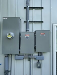 A professionally installed exterior electrical meter and service disconnect boxes by Grounded Electric LLC in Smithfield, VA.