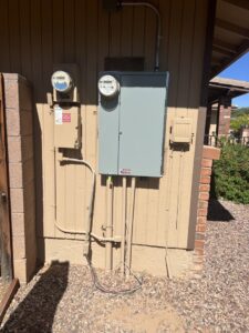 An exterior electrical meter and service panel installed on a house by G5 Electric LLC in Phoenix, AZ