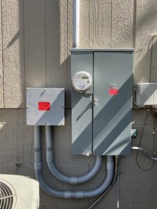 An exterior electrical meter and service panel installation by McCurley Electric, ensuring reliable power in Little Rock, AR.