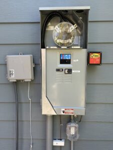 An exterior electrical meter and service panel installed by Mister Sparky of Greensboro in Greensboro, NC.