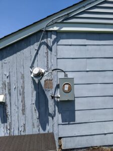 Exterior electrical meter and service entrance conduit on a residential building by ZAP Electric LLC in Greeley, CO.