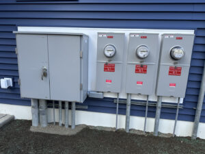 Multiple exterior electrical meters and a service panel installed by Right Electrical Services LLC in Raleigh, NC.