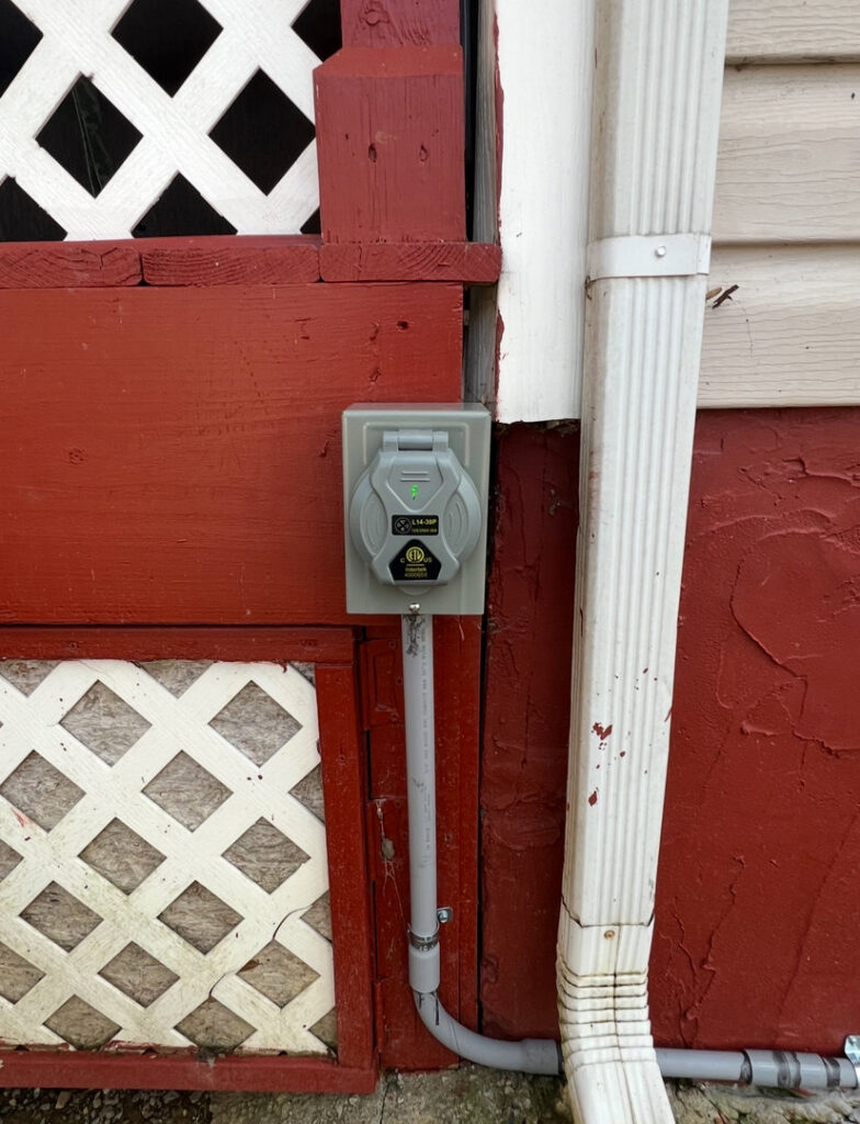 An exterior electrical outlet installation by Raschke & Sons Electric in Chattanooga, TN