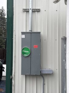 A close-up of an exterior electrical panel with a main disconnect installed by LN Electrical in Coeur D Alene, ID