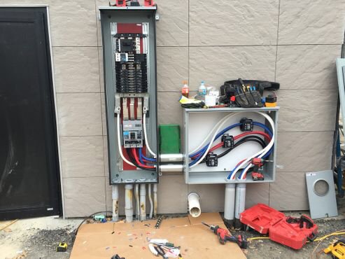 Exterior electrical panel and conduit installation by Erbert Electric in Overland Park, KS