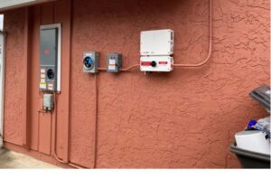 Exterior electrical panel and solar inverter installation by Madison Electrician Now in Madison, AL.