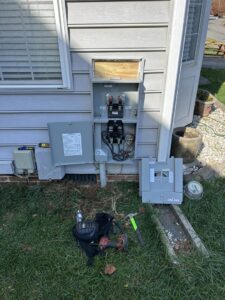 An exterior electrical panel and meter base open for an upgrade or repair by Right Electrical Services LLC in Raleigh, NC.