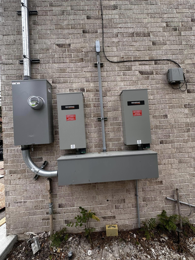 Exterior electrical panels and Generac transfer switches installed by A&f electric service in Houston, TX