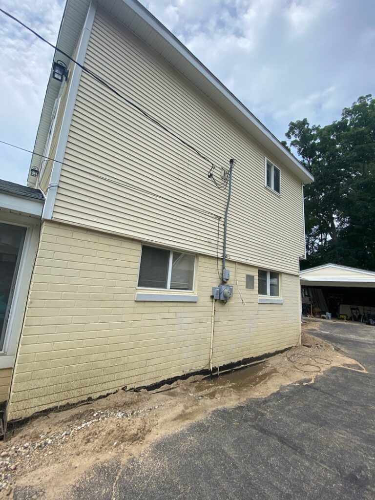 The exterior electrical service entrance, meter, and conduits on a house, installed by Titus & Son's Electric in Bluffton, IN.