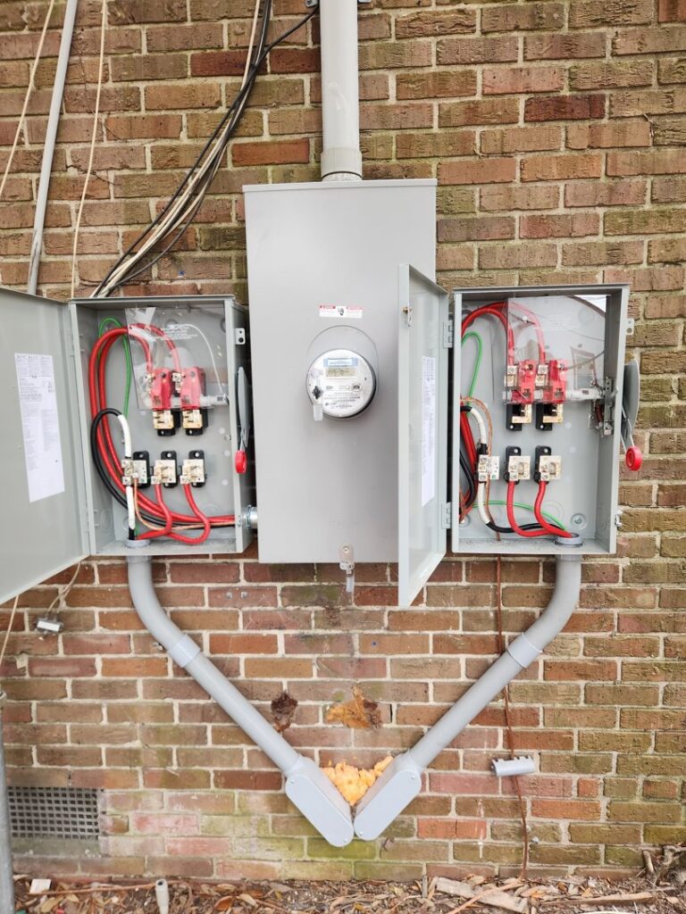 An exterior electrical service entrance with meter and main disconnect panels installed by ALC Electric LLC in Goose Creek, SC
