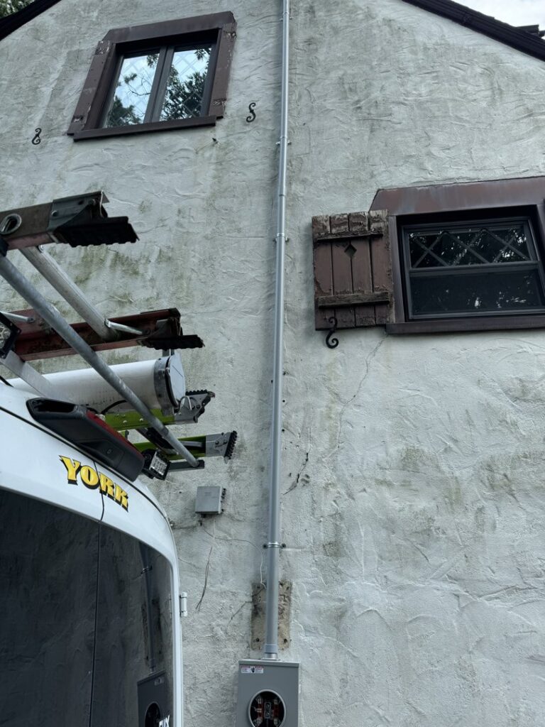 New exterior electrical conduit and meter box installed on a house by York Electric of Westchester in Yonkers, NY.
