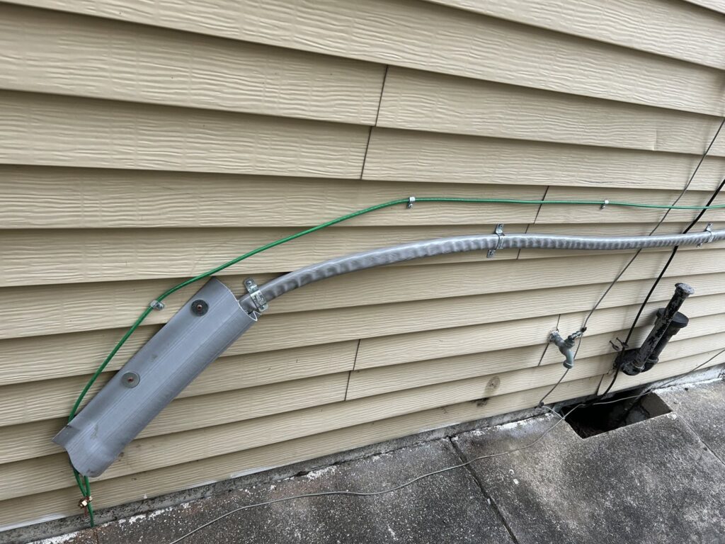 Exterior electrical service line and conduit installed by 2 Live Wires in Slatington, PA.