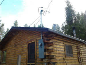 Exterior electrical service installation on a log cabin by Accuracy Electric Incorporation in Lakewood, CO.