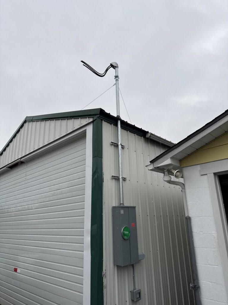 An exterior electrical service mast and conduit installed on a building by LN Electrical in Coeur D Alene, ID