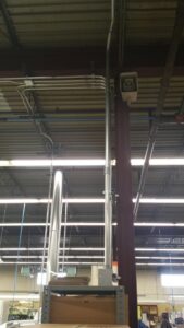 Exterior view of a house showing electrical service entrance, meter, and conduit installed by VIP Electrical Services in Naperville, IL.