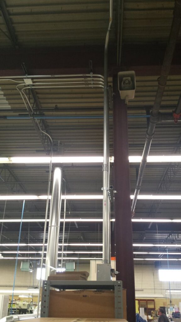 Exterior view of a house showing electrical service entrance, meter, and conduit installed by VIP Electrical Services in Naperville, IL.