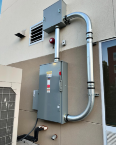 Exterior electrical service panel and conduit installation on a commercial building by Revamp Electric LLC in Columbus, OH.