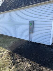An exterior electrical service panel and meter on a home, recently upgraded by Josh LaFerriere Electric in Westbrook, ME.