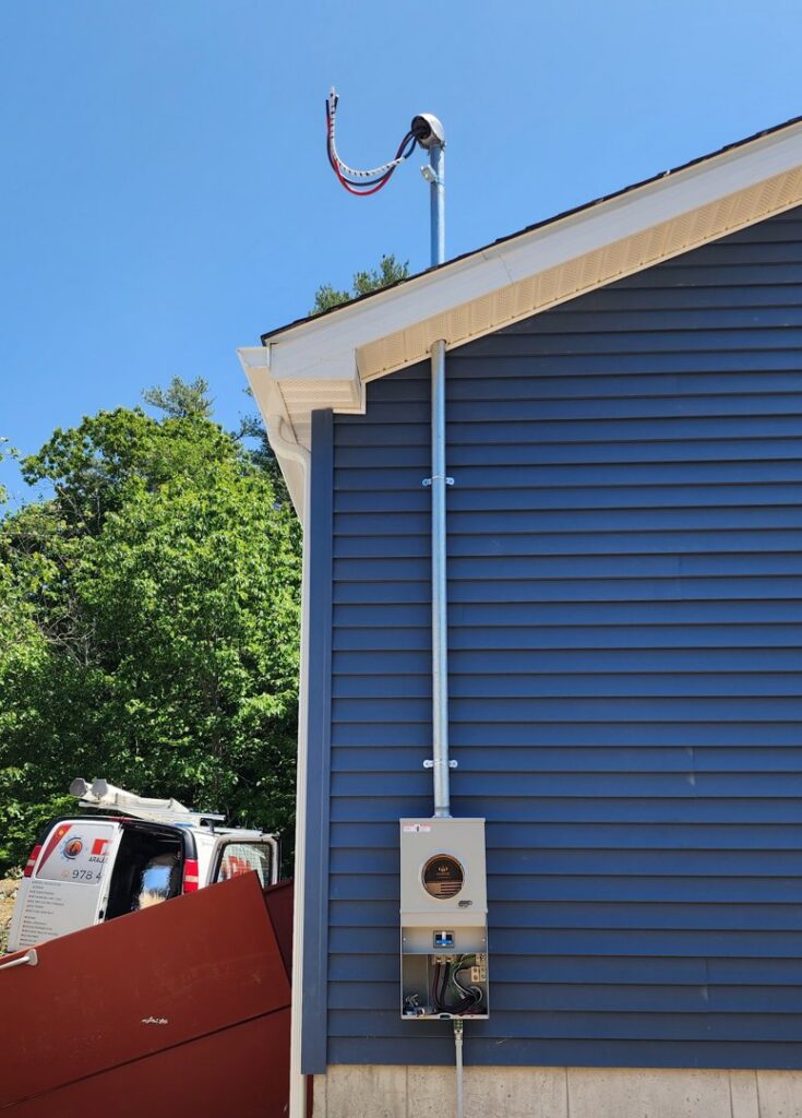 Exterior electrical service upgrade and meter installation by Julio A Lopez Electrician in Lowell, MA.