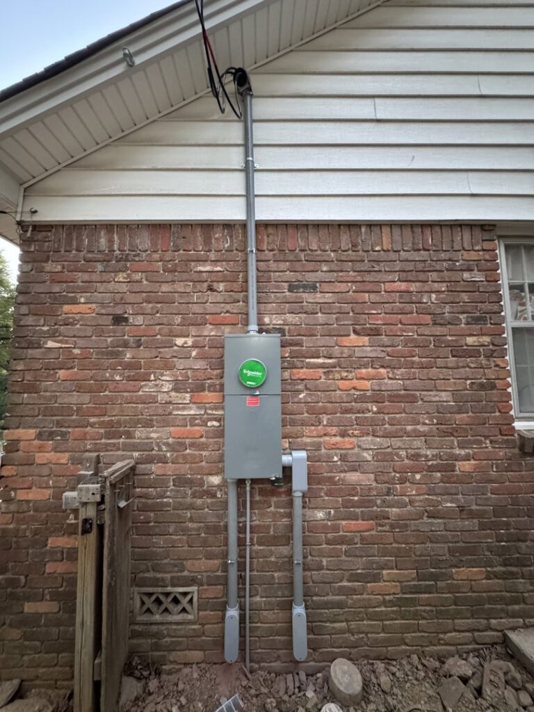 A newly installed exterior electrical service mast and meter panel by McCurley Electric in Little Rock, AR.