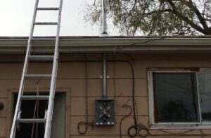An exterior electrical service panel and conduit installation on a house by The Electric Way in Colorado Springs, CO.