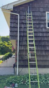 An exterior electrical service upgrade in progress with a ladder, performed by York Electric of Westchester in Yonkers, NY.