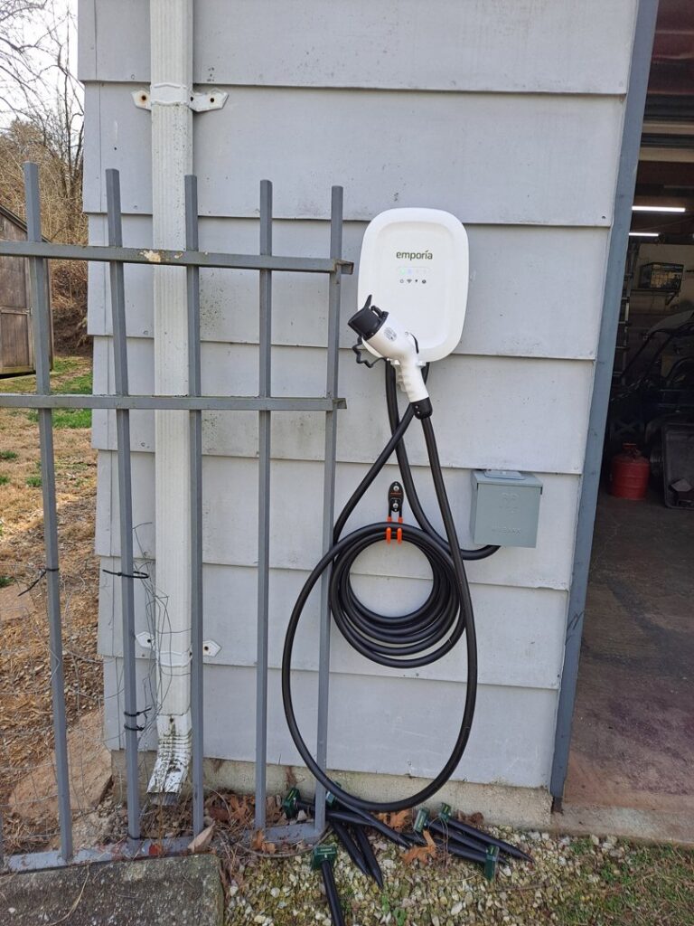 An exterior Emporia electric vehicle charging station professionally installed on a home by J. Bathe Electric in Saint Charles, MO.