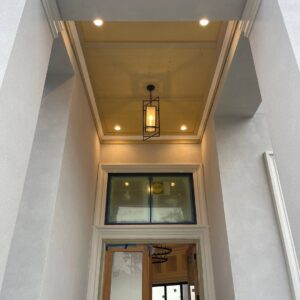 Exterior entryway featuring a modern pendant light and recessed lighting installed by J&M Electrical Services in Stockbridge, GA.