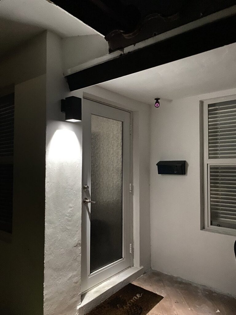 Exterior front door lighting installation by Elite Electrical Concepts, LLC in Deerfield Beach, FL.
