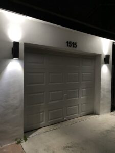 Exterior garage lighting installation by Elite Electrical Concepts, LLC in Deerfield Beach, FL.