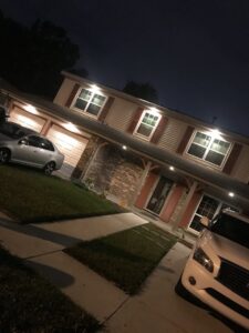 A home exterior at night showcasing new outdoor lighting installed by Joule Electrical A/C & Heating Services in New Orleans, LA.