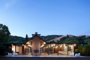 Exterior of a modern house at dusk with professional lighting installation by R.C Electric, Inc. in San Francisco, CA