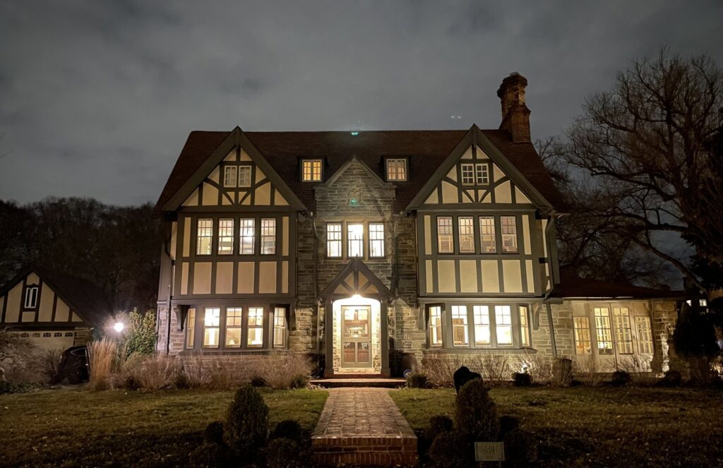 A beautifully lit house at night, showcasing exterior and interior lighting services by GEN3 Electric & HVAC in Philadelphia, PA.